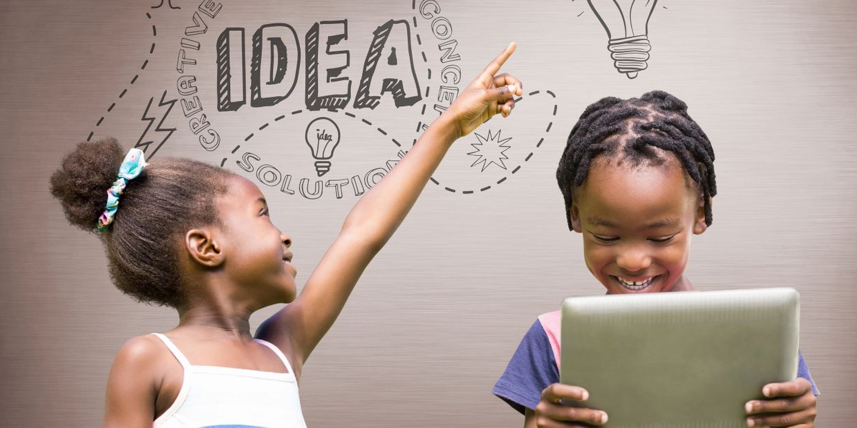 Two children brainstorming ideas with one pointing up and the other holding a tablet.