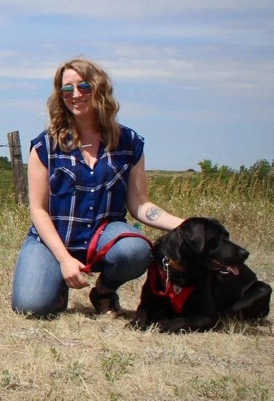 Linzi here with a therapy dog which helps her service dog research