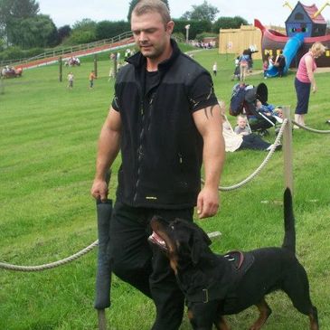 Kevin Howes with his GP security Rottweiler Cleo. Demonstrating obedience in public places