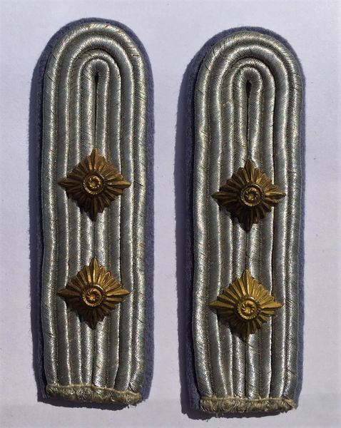 Transport officers sew in Shoulder Boards rank of Hauptmann ( Captain)