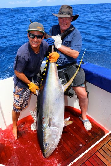 Happy guest with his biggest tuna with tahiti sport fishing guided fishing charter