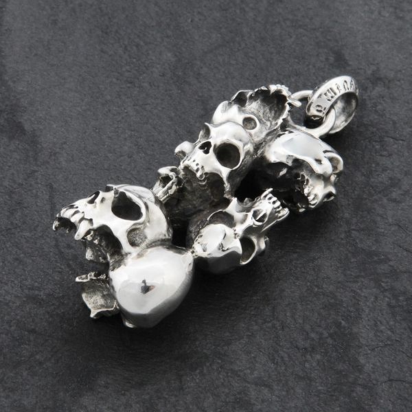 79. 7 Skulls - Sterling Silver Pendant