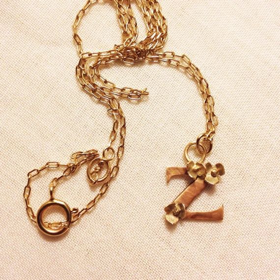 Rose gold initial with tiny gold flowers