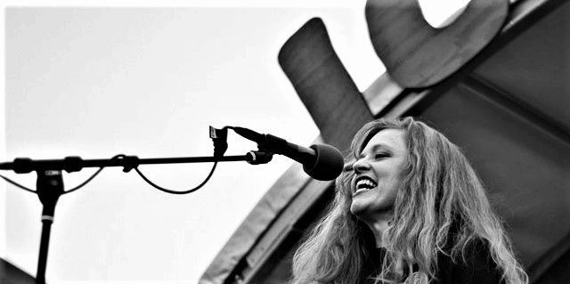 Julie Fogerson, stage, mic, perform, voiceover, voice, artist, sing, Antarctica, Icestock, rock