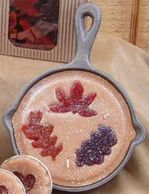 These one of a kind candles come in a real 8-oz cast iron pan and contain fruit and berry embeds.