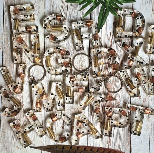 Beautiful letter keyrings, cartridge components and bullet casing with