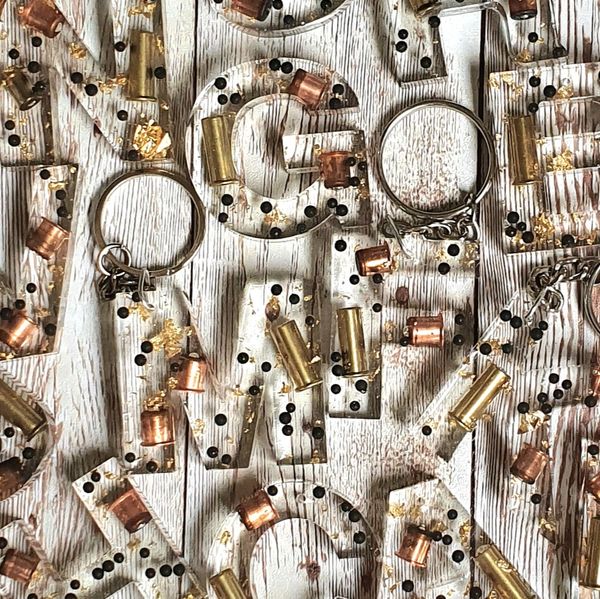 Beautiful letter keyrings, cartridge components and bullet casing with
