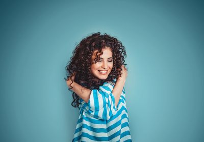 Holistic Latinas,  Latina, Woman hugging herself, self-love, self-care, first generation,