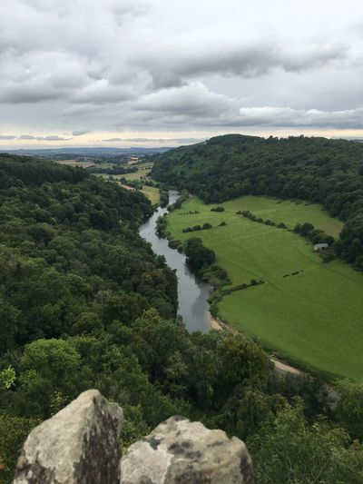 Photograph of the River Wye taken from Symonds Yat rock. River in the valley, green fields and woods.