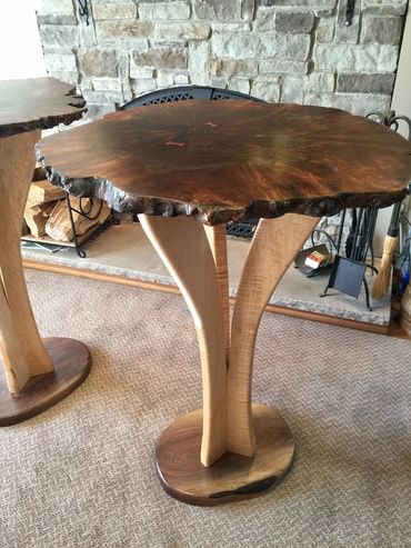 Claro Walnut High top table with curly maple pedestal and black walnut base.