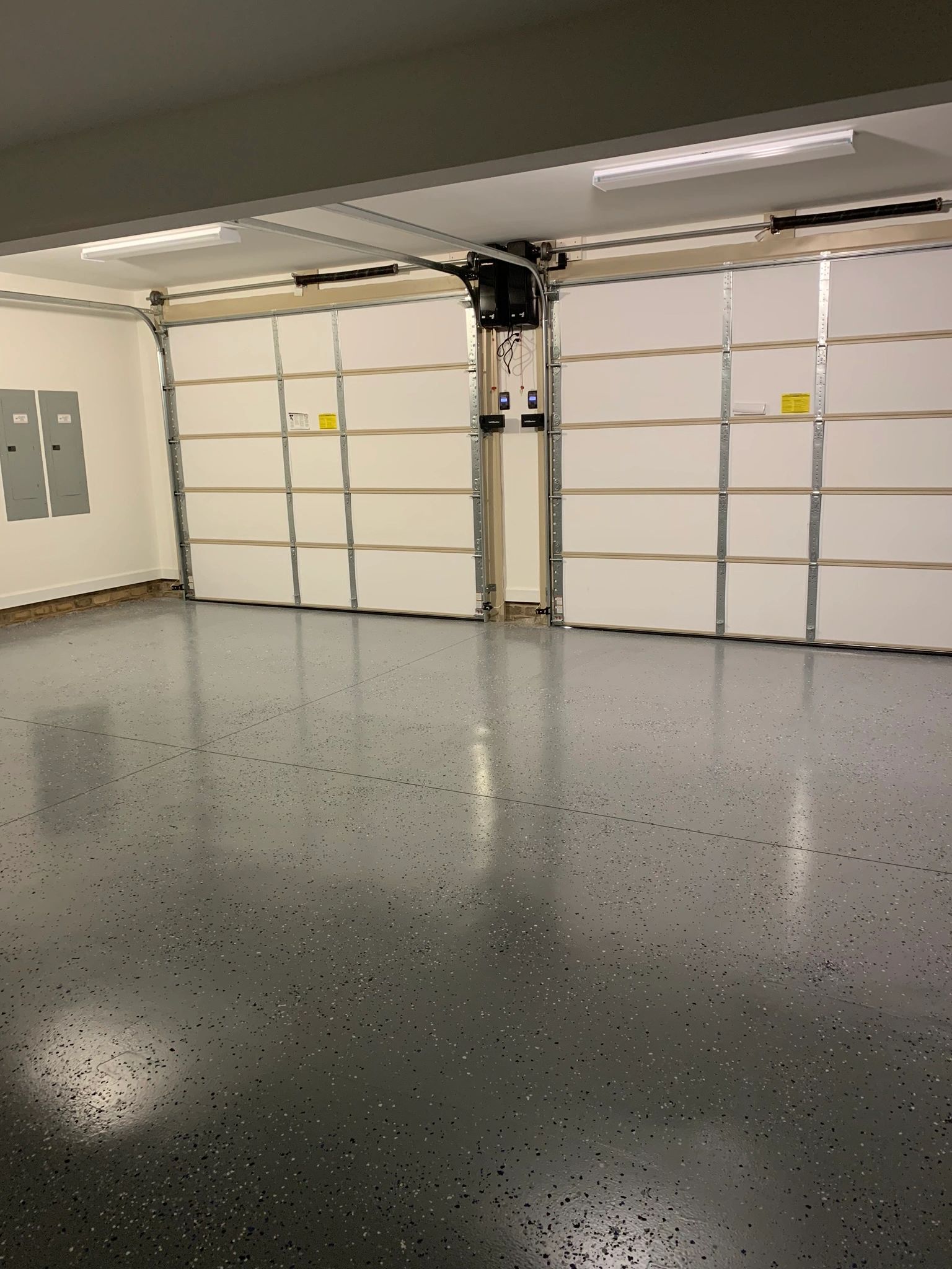 Double garage doors with epoxy floor.