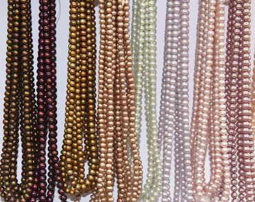 Round Fresh Water Pearls in  strands  - lavender, peach, brown, cream, brown round pearls.  