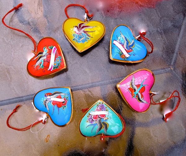 Heart ornaments with birds and flowers