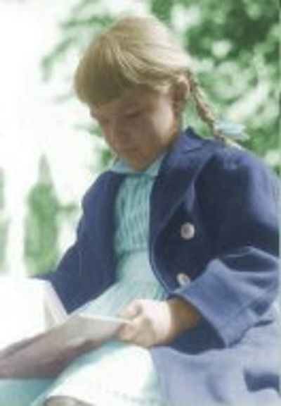 A kid holding a book