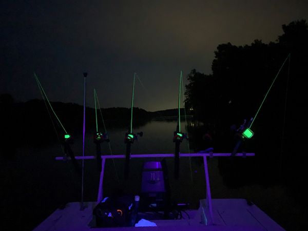 Black light install on Jon boat lights up rods for night fishing! 