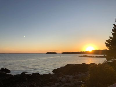 Sunset over Atlantic Ocean in Stonington, Maine, USA - Photo by Deneen Bernier