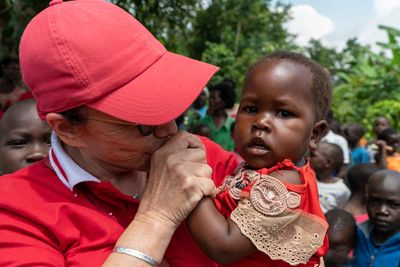 Founder Holding a native child