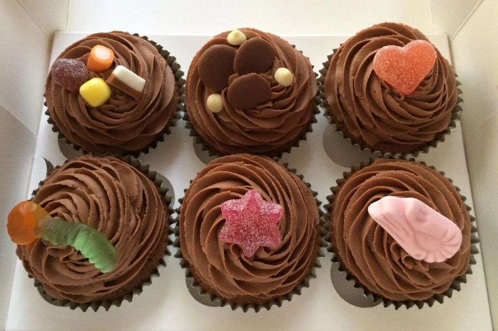 Children's Chocolate Cupcake selection topped with Sweets and Chocolate Buttons. 07824 705364.