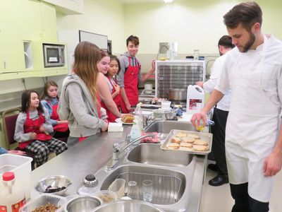 Accelerate Youth students in the kitchen learning how to create affordable, healthy meals.  