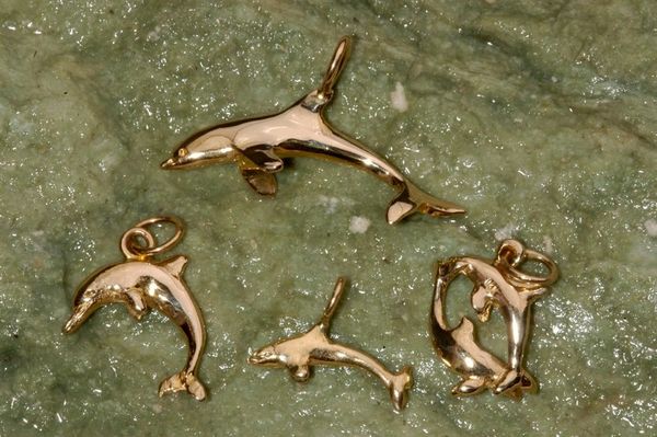 Single Dolphin, featured image is of some different dolphin pieces. Click here to see all the different styles and prices we offer.
