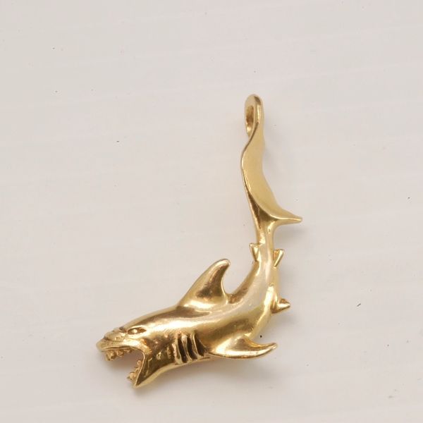 Shark Collection. These are our small sharks without a real Great White Tooth. Featured Image is our small yellow gold Shark by the Tail.