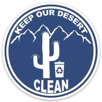 "Keep Our Desert Clean" round blue logo with image of cactus, recycling bin, and mountains in background.
