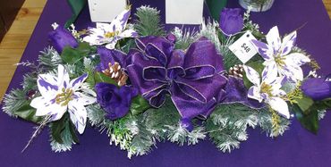 32” Mixed Pine Centerpiece w/ Purple Bow, Fairy Lights, Purple/White Poinsettias, Purple Rosebuds