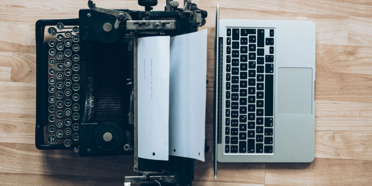 Typewriter and Laptop back to back