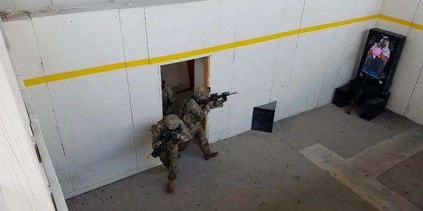 Soldiers in one of my former units entering and clearing a room in a shoot house