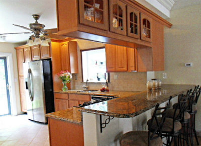 Kitchen renovation involved removing a wall, selecting all cabinets, measuring and selecting the cor