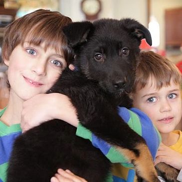 Happy family with our of our pups.