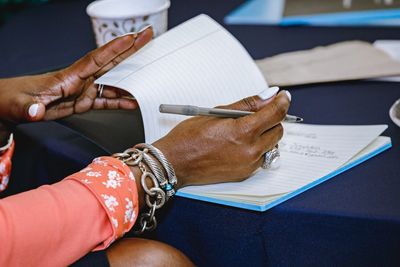 Woman taking notes during first BPH event. 