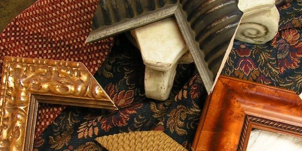 Close-up of mitered frame samples highlighting premium materials and refined framing profiles.