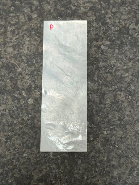 .032” x 1” x 3.5” White Mother of Pearl. D.