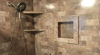 Stone colour shower wall surround with matching recessed niche and corner shelves for walk-in shower