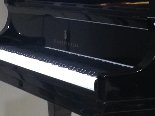 Close-up of a Steinway &amp; Sons piano keyboard.