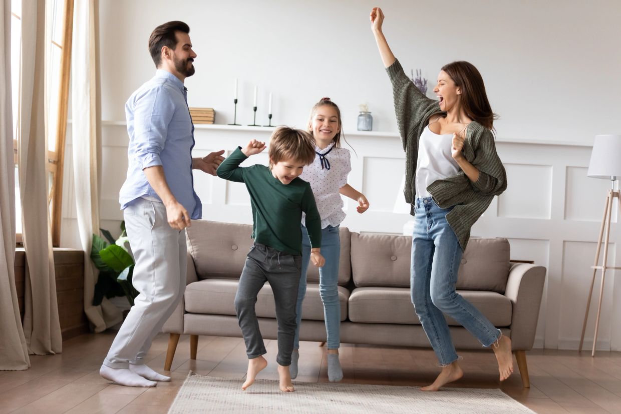 Happy Family jumping after property purchase and pre purchase building and pest inspection 