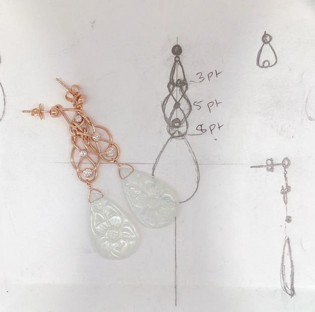 Custom made dangle earrings with rose gold wire, diamonds, and engraved moonstone on sketch.