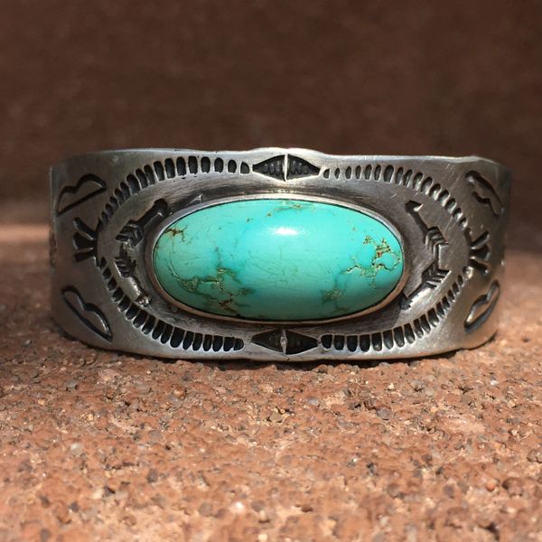 SOLD OVAL DOMED LIGHT BLUE CROSSED ARROWS, ZIA SUN, BOWS & TUNDERBIRD STAMP WIDE SILVER CUFF BRACELET SMALL WRIST