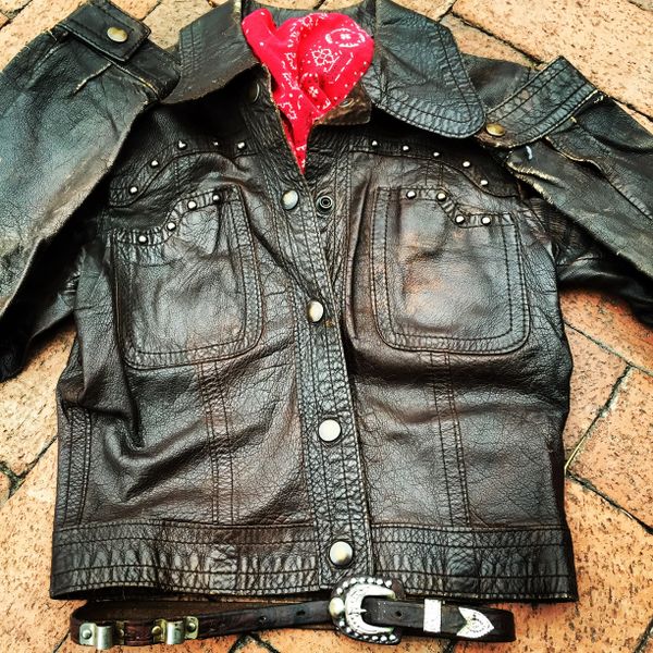 SOLD 1960S FRAMED LADIES SMALL VINTAGE STUDDED LEATHER BIKER JACKET, COWBOY BELT, BANDANNA SET