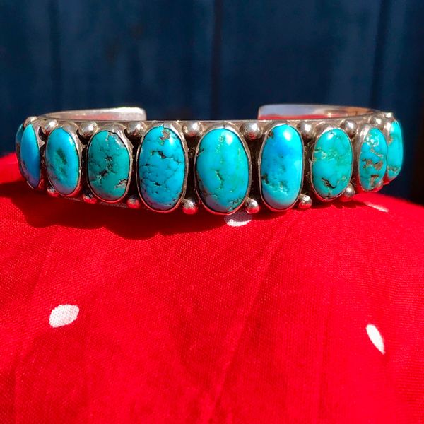 SOLD 1920s VIVID BLUE OVAL 11 TURQUOISE STONE ROW CUFF CARINATED INGOR SILVER BRACELET