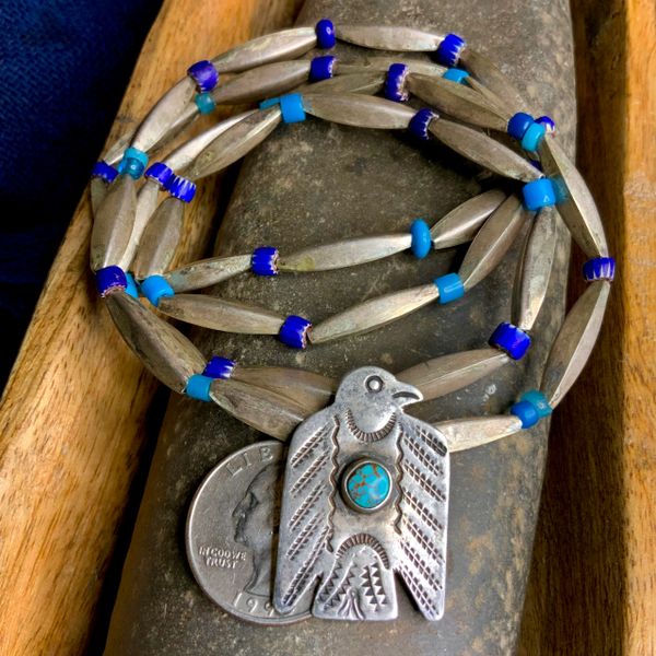 SOLD 1910s SILVER THUNDERBIRD DOG TAG PENDANT WITH 1800s AMERICAN GLASS FUR TRADE BEADS AND LONG SILVER 1930s BENCH BEADS