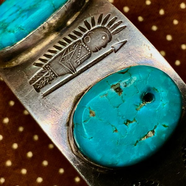 1920s RARE DARKEST NEON BLUE TURQUOISE TABS SET IN AN IGNOT SILVER CUFF BRACELET WITH INDIAN CHIEF & CLOUD STAMPS, PEYOTE BUTTON REPOUSSEE' & TERMINAL STONES