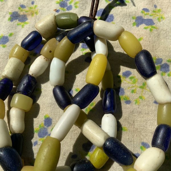 1600 ANTIQUE NATIVE AMERICAN TRADE BEADS YELLOW, WHITE AND COBALT BLUE ON LEATHER