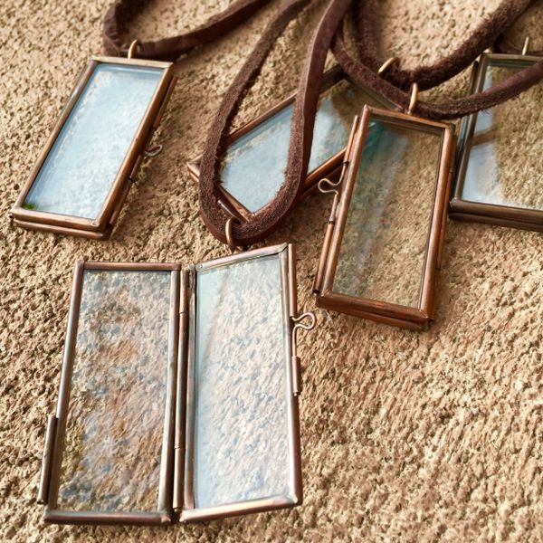 COPPER CREST GLASS & METAL PENDANT KEEPSAKE LOCKET on AMERICAN DEERSKIN