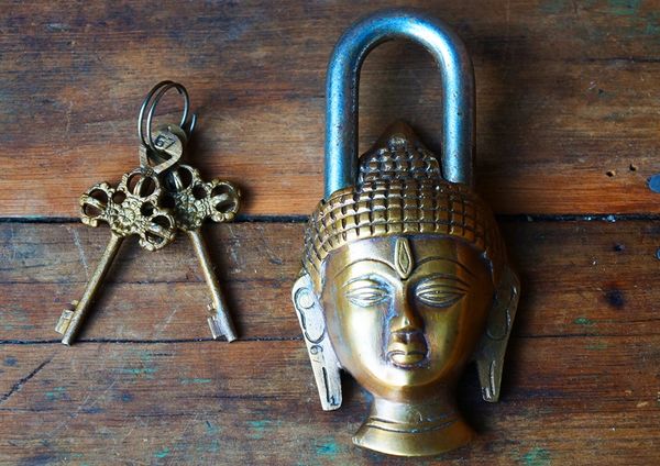 SOLD BUDDHA HEAD BRASS AND STEEL PADLOCK