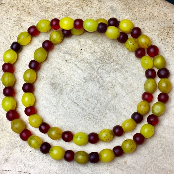 SOLD 1800s BIG HEAVY PUEBLO TRADE BEADS MANDREL WOUND MIX OF DARK TO NEON YELLOWS & DARK TO CHERRY REDS ATELIER RESTRUNG ON BLACK SINEW