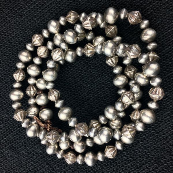 SOLD 1920s NAVAJO PEARL BENCH BEADS WITH 1930s FLUTED HOG AN BEADS ATELIER RESTRUNG ON LEATHER 37”