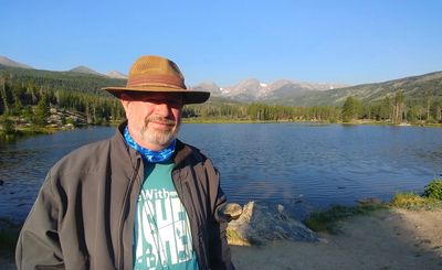 Dave watching for moose at Sprague Lake in Rocky Mountain National Park.