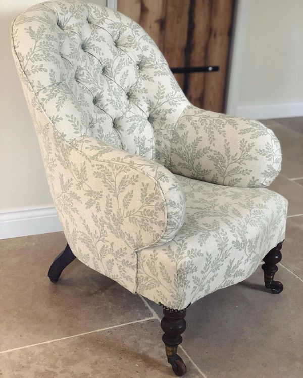 buttoned iron back chair in Clarke and Clarke Fabric